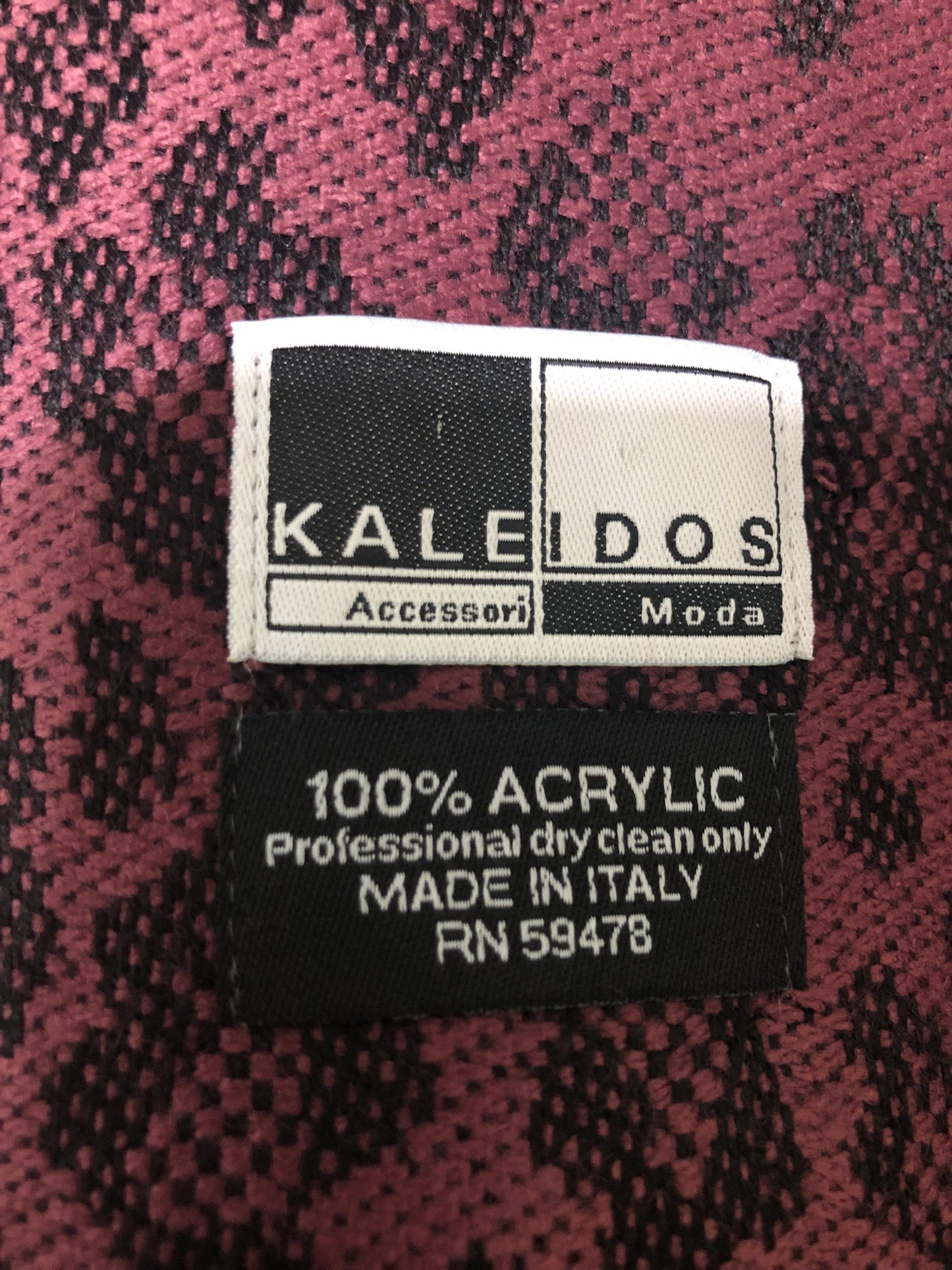 Kaleidos Moda Burgundy and black wrap/scarf with animal print and fringes.