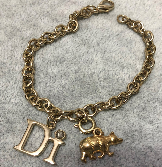 Diamonds International Charm Bracelet with a Grizzly Bear and DI Charm